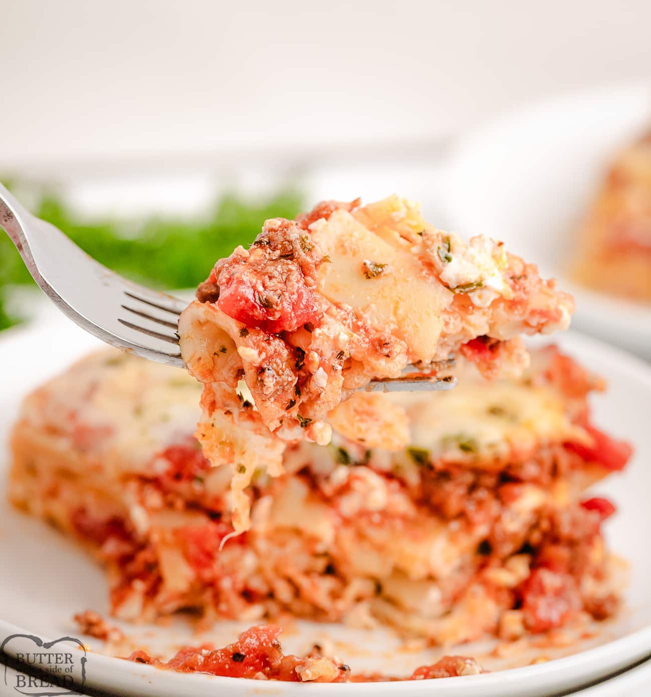 bite of lasagna with cottage cheese