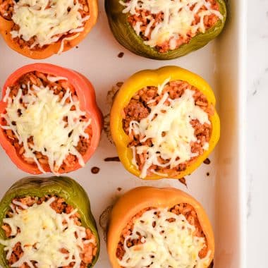stuffed bell peppers with mozzarella cheese on top