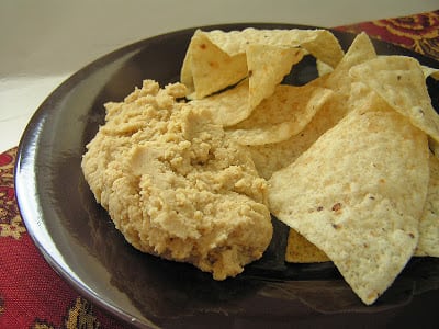 If you haven't tried hummus yet, I encourage you to try it. It's a dip or spread that's made from garbanzo beans {also known as chickpeas.} It's super healthy, filling, yet also a nice, light snack. My kids and I both love it.