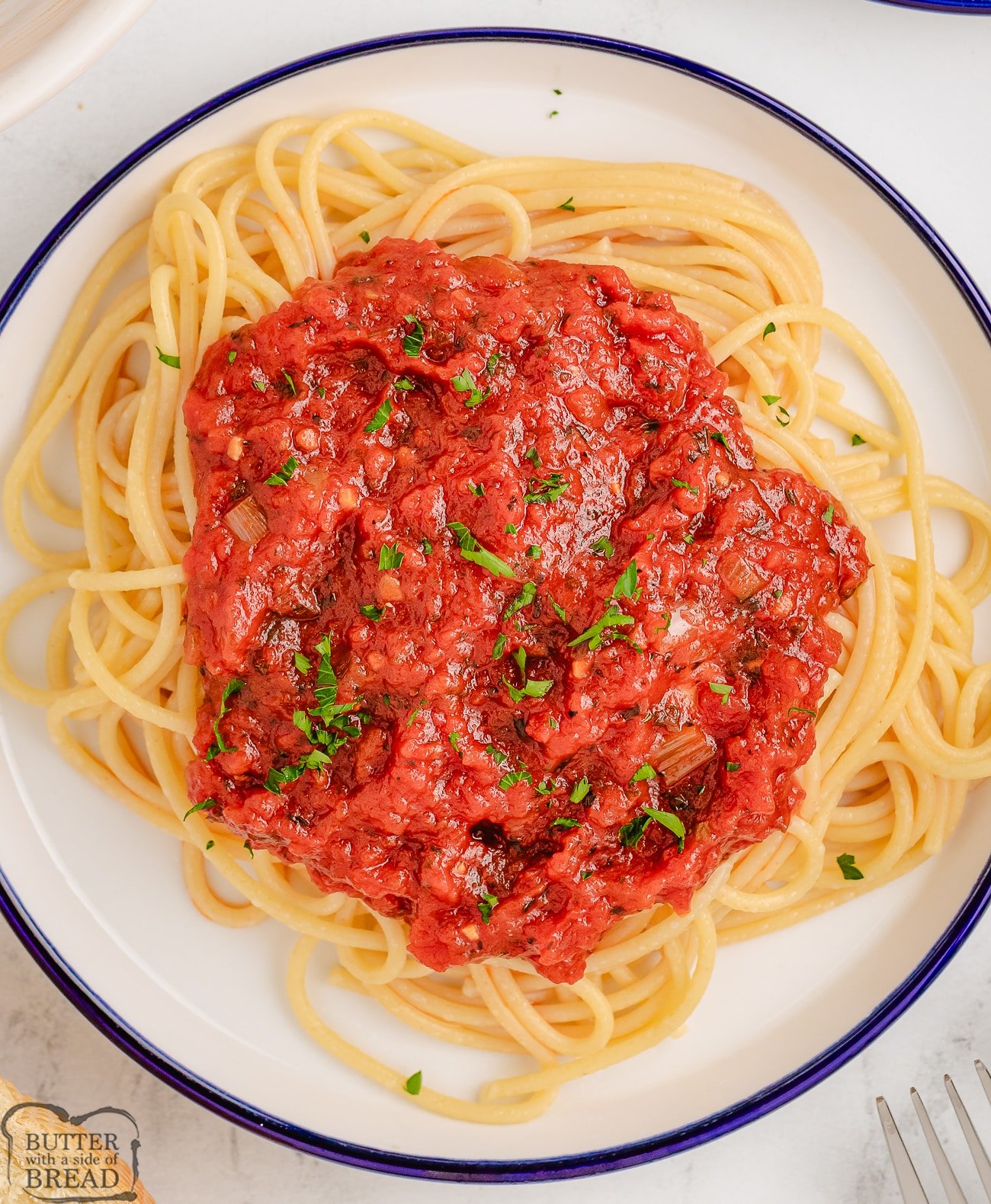 marinara sauce on pasta on a plate
