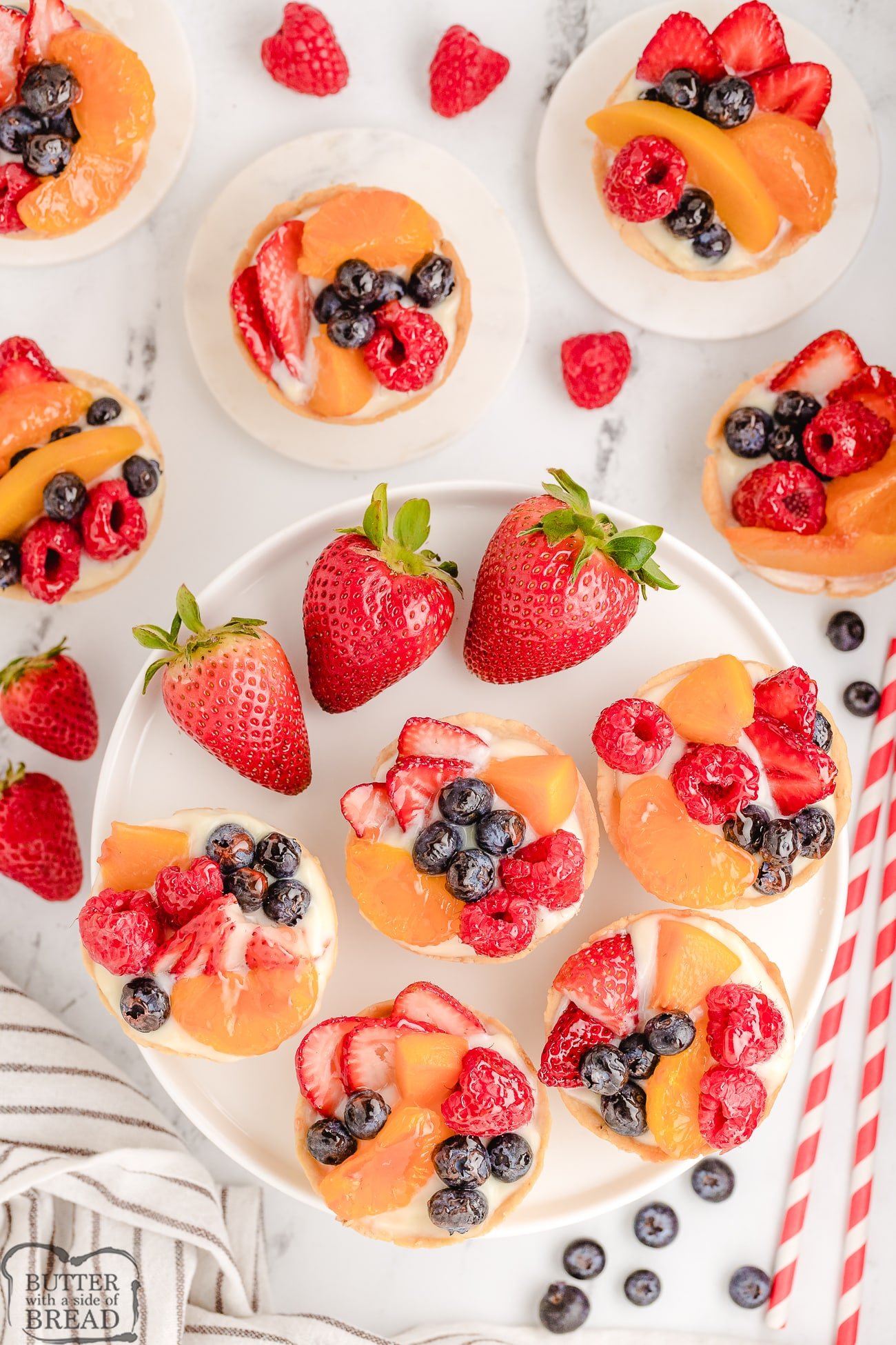 fresh fruit tarts with berries and vanilla pudding