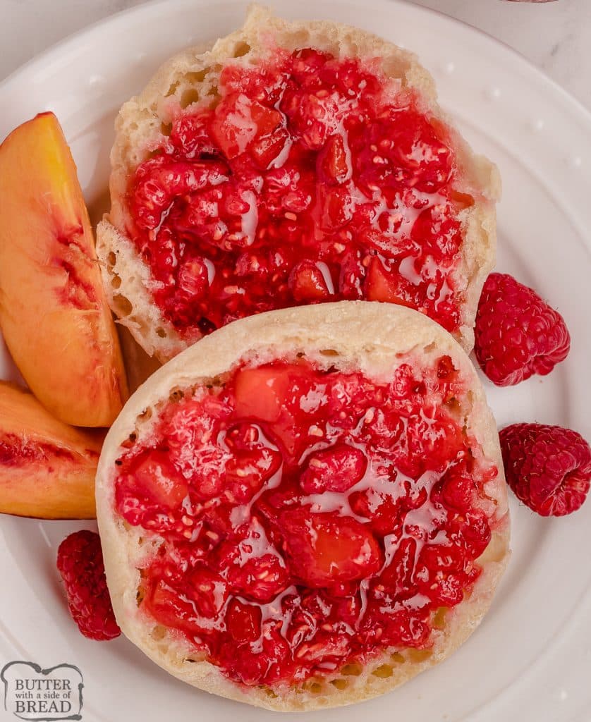 raspberry peach freezer jam on a muffin