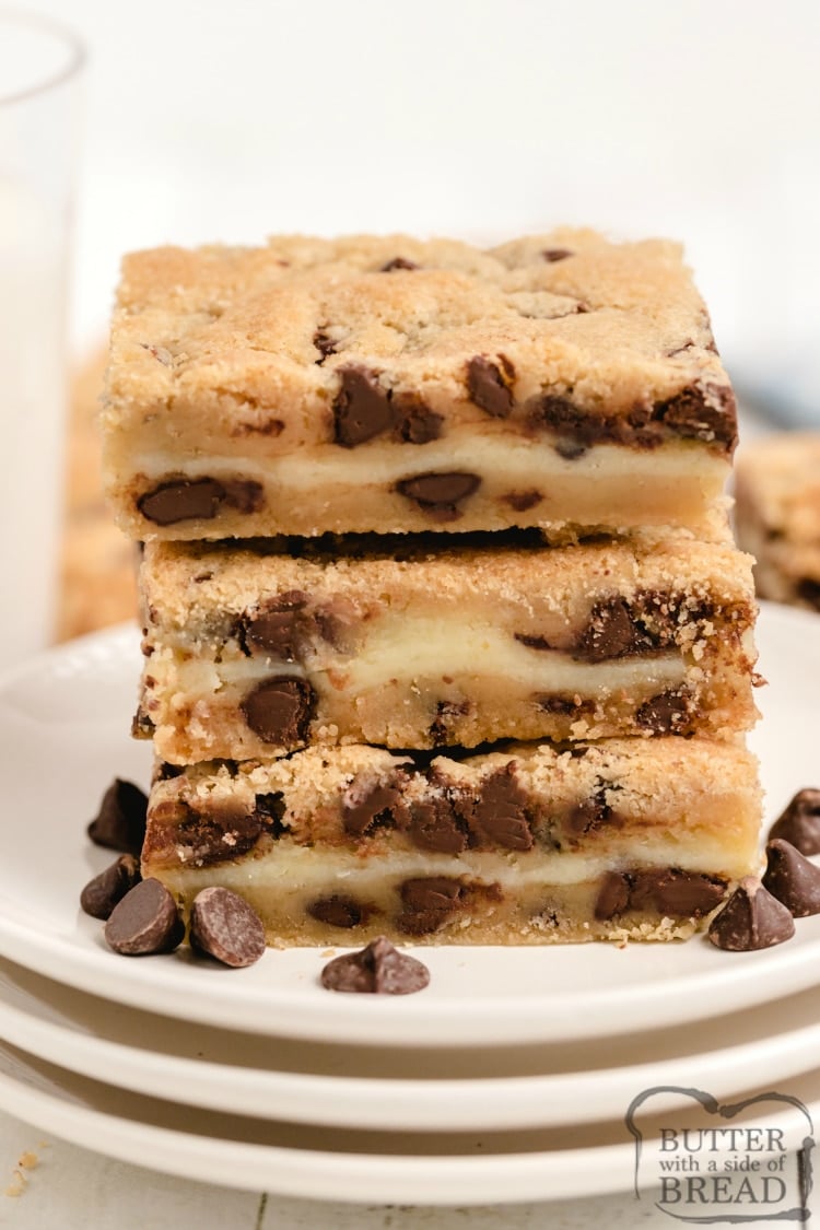 Cheesecake Chocolate Chip Cookie Bars combine a delicious chocolate chip cookie recipe with a layer of cheesecake to make a dessert that is the best of both worlds! This amazing bar cookie recipe is simple to make and a hit at every party! 
