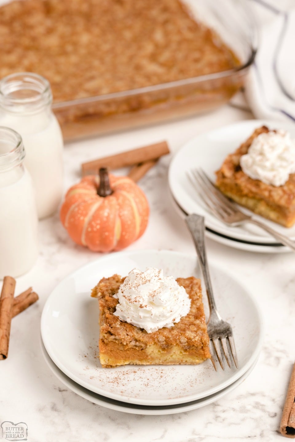 Pumpkin Pie Cake is festive Fall dessert made with a cake mix & pumpkin. Easy layered pumpkin cake that comes together fast and is a family favorite! 