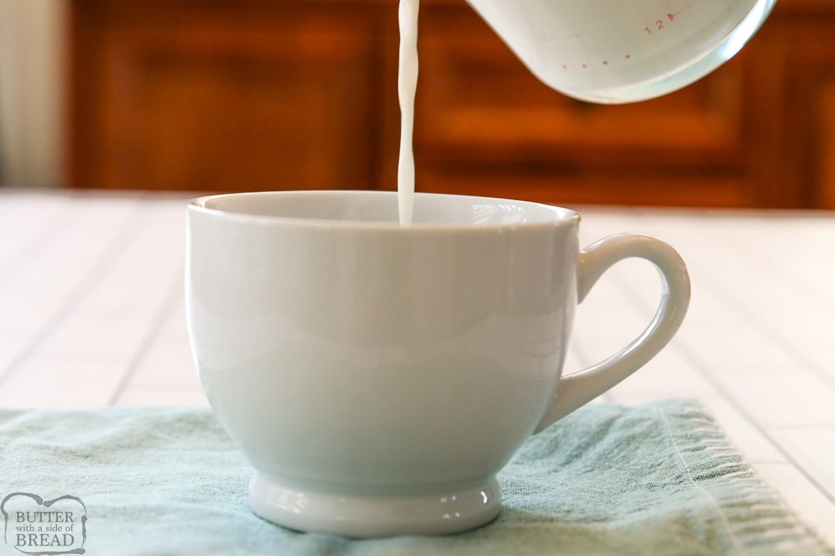 pouring milk in a mug