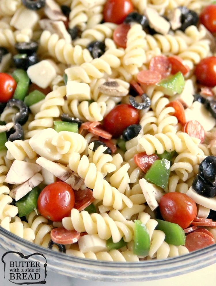 Pizza Pasta Salad is easy to make and full of pepperoni, mozzarella cheese, olives and all of your other favorite pizza toppings! This pasta salad is perfect for parties and potlucks!