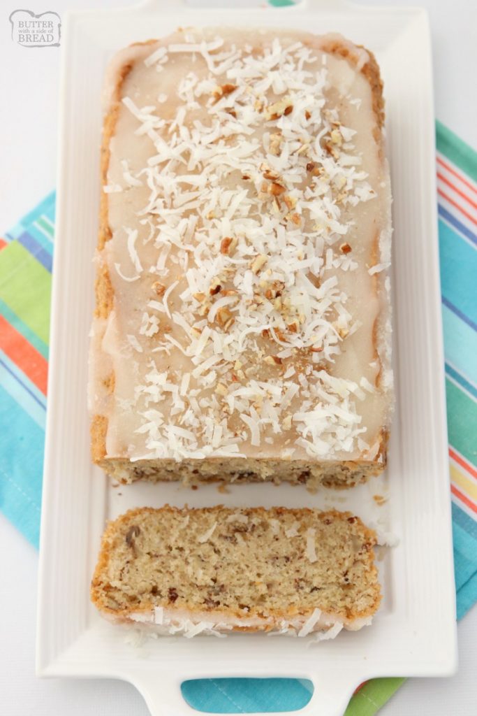 Sweet Coconut Bread is a moist sweet bread made with milk, flour, coconut and pecans. Topped with a sweet coconut glaze, flake coconut and more pecans, you won't be able to resist a slice!