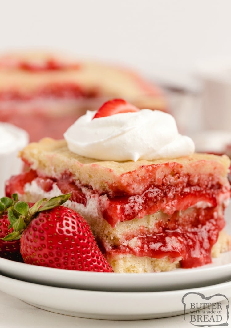 Strawberry Shortcake Bars are made with layers of sugar cookies, fresh strawberries, homemade strawberry syrup and sweetened whipped cream. These icebox cookie bars are somewhere in between traditional strawberry shortcake and fruit pizza.