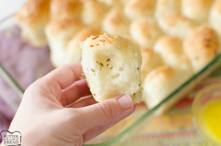 Easy Parmesan Garlic Dinner Rolls made from frozen rolls and tossed with butter and seasonings. Bakes in under 30 minutes, everyone loves these soft, buttery dinner rolls!