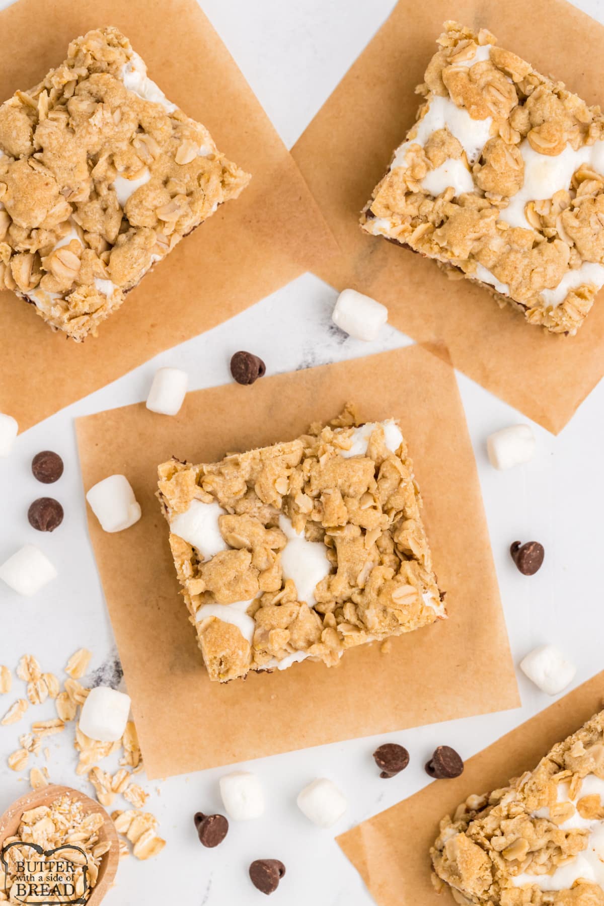 Marshmallow Oatmeal Chocolate Chip Bars are sweet, gooey and absolutely delicious. Marshmallows and chocolate chips are layered between two layers of a simple oatmeal cookie crust. 