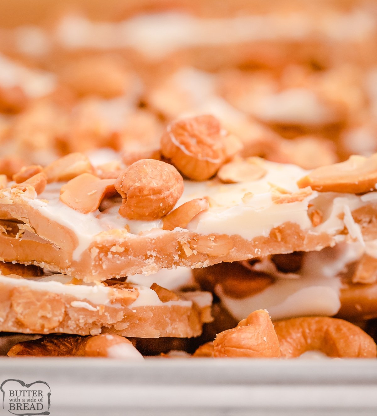 side view of homemade toffee topped with cashews