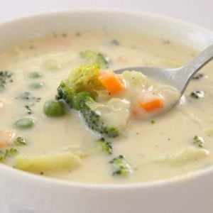 Creamy Vegetable Soup made easy in 30 minutes or less! Simple, flavorful & comforting vegetable soup recipe perfect for cold nights. Time saving tips too!