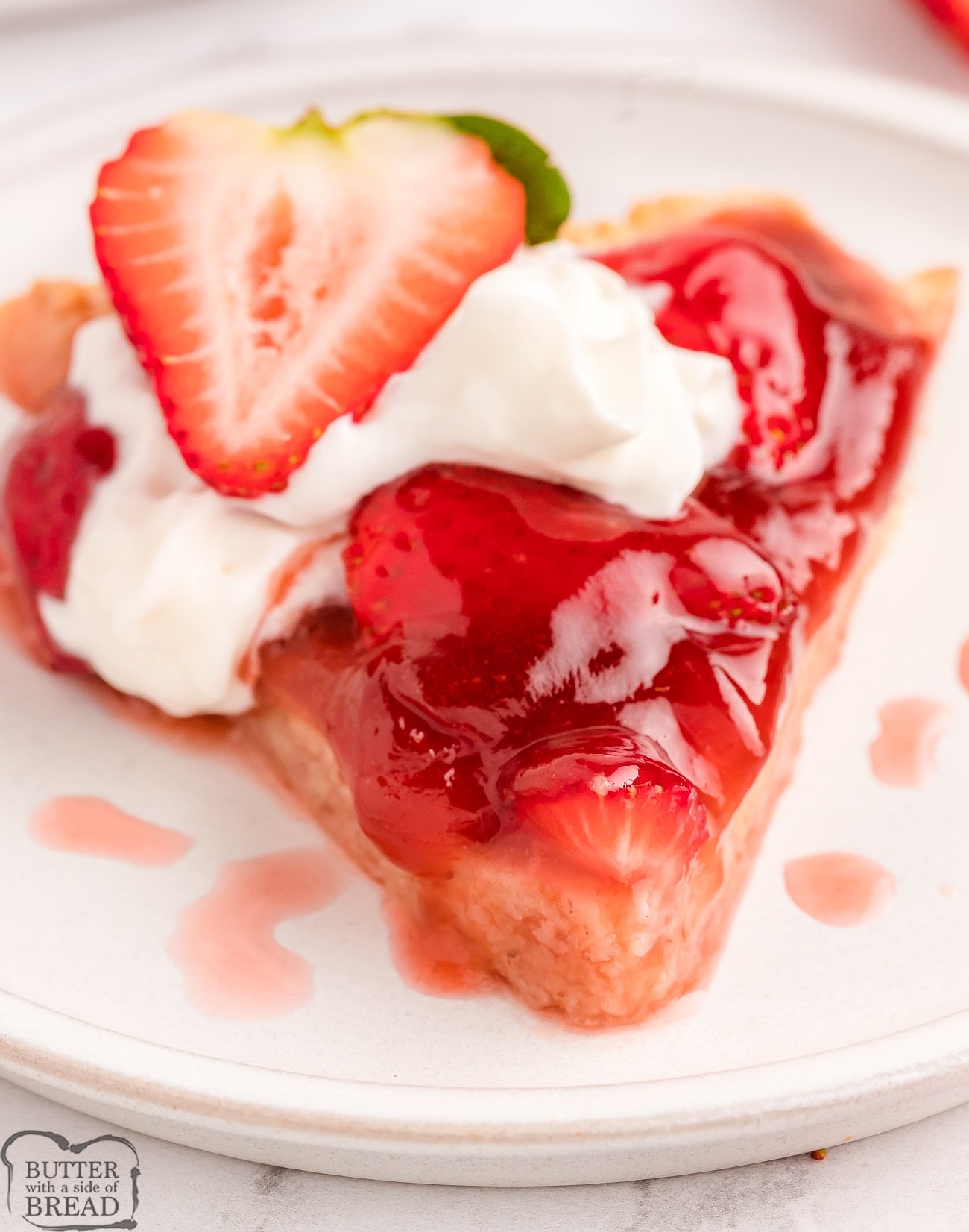 slice of strawberry tart with whipped cream