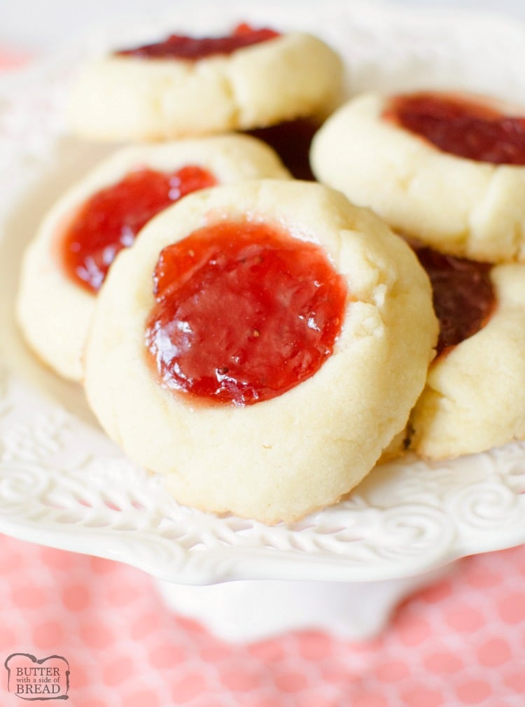 Easy recipe for Soft Jam Thumbprint Cookies perfect for the holidays! Buttery cookies with great flavor, filled with your favorite sweet jam. Perfect for Christmas cookie exchanges! 