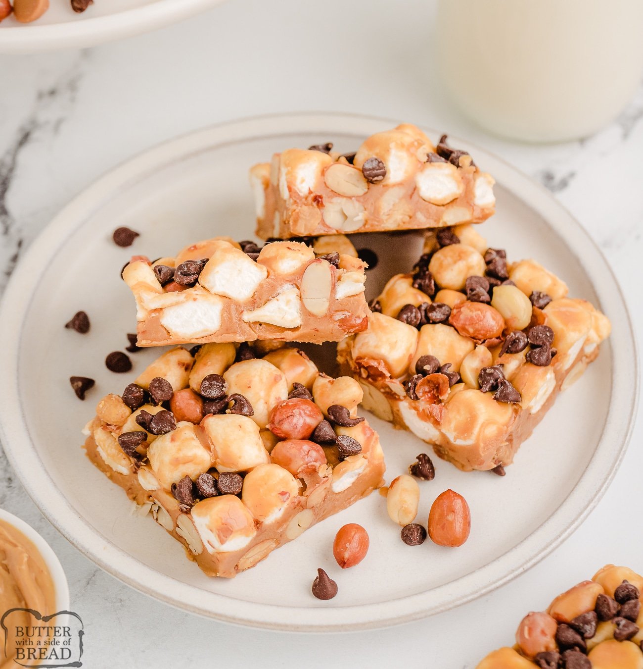squares of butterscotch peanut butter marshmallow bars on a plate