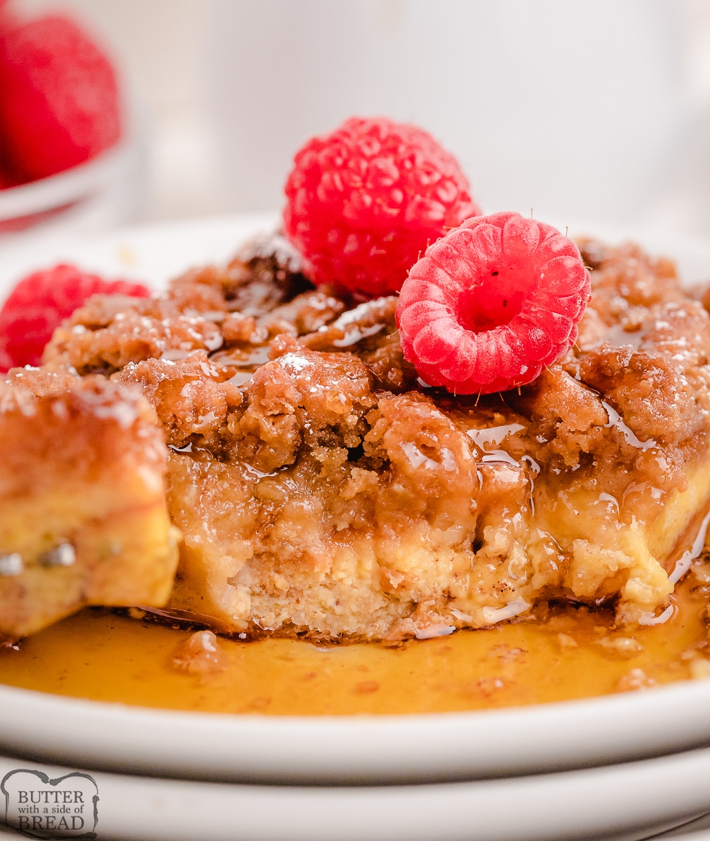 scoop of baked French Toast Casserole with raspberries