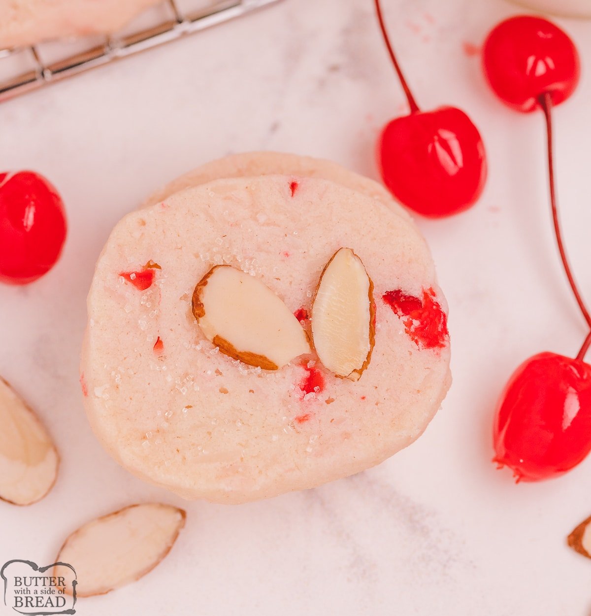 cherry shortbread cookies with sliced almonds on top