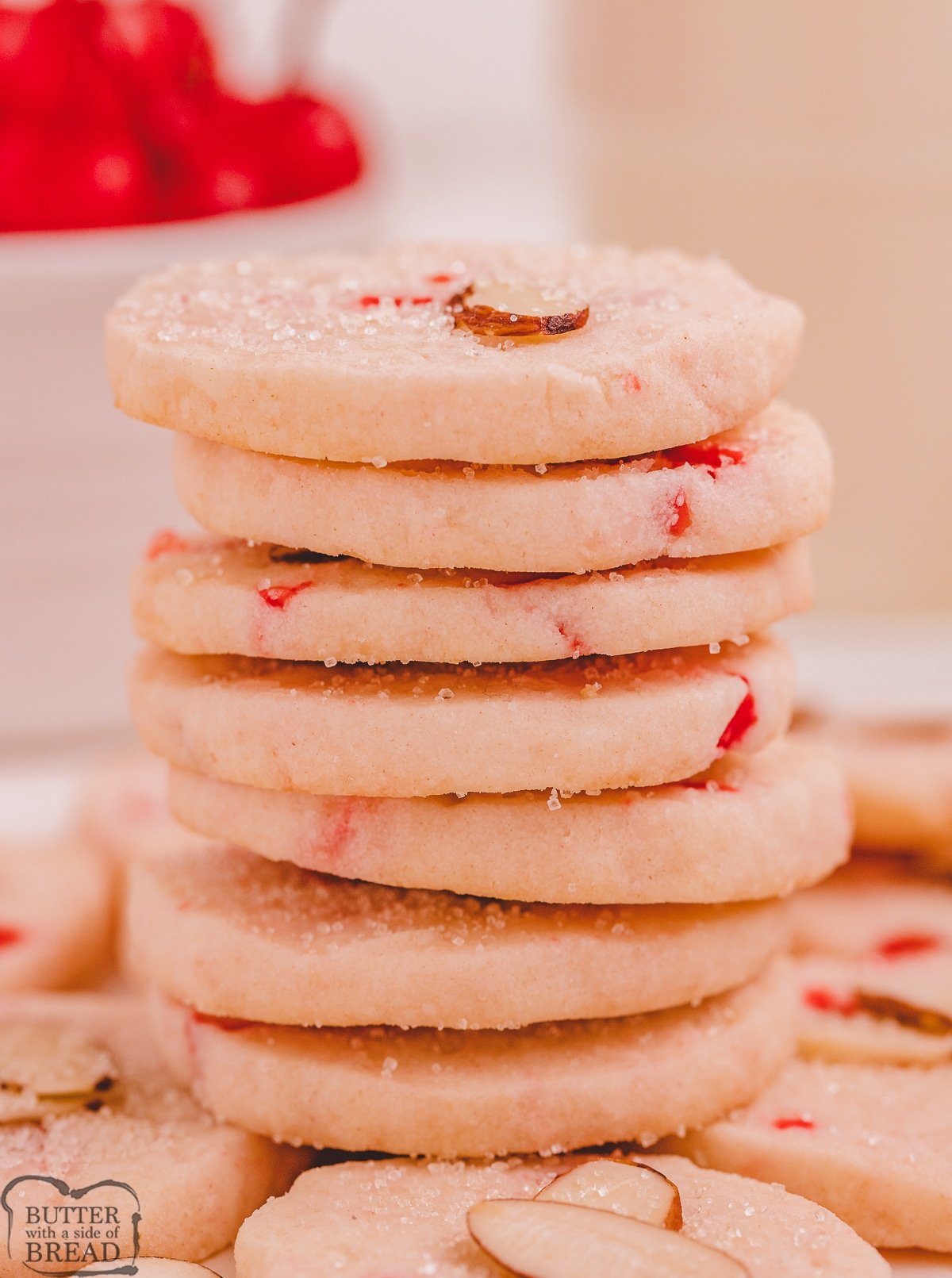 stacked shortbread cookies with maraschino cherries