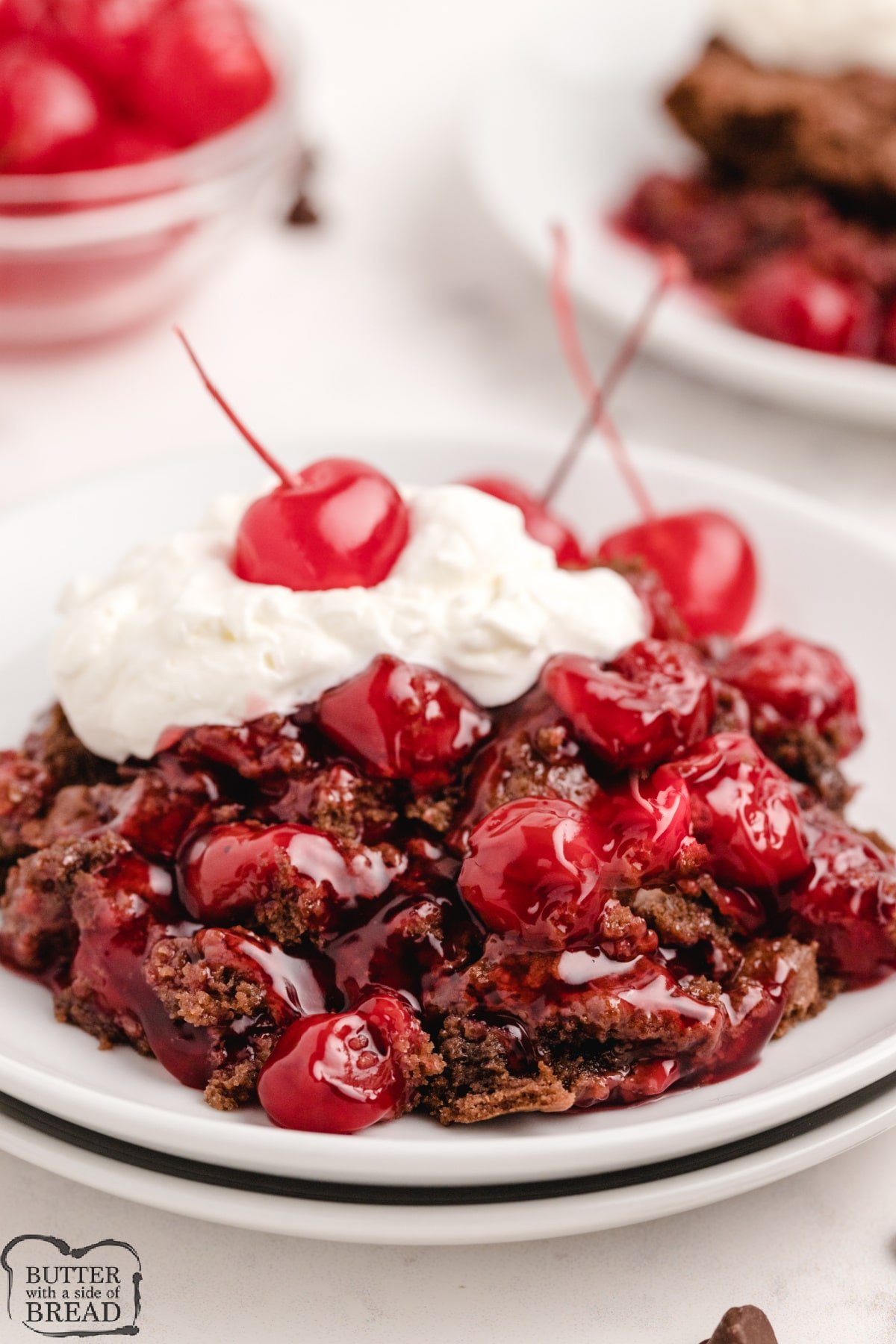 Chocolate Cherry Cobbler is a tasty variation on the traditional cherry cobbler recipe. Canned cherry pie filling baked with a simple crust made with melted chocolate chips. 