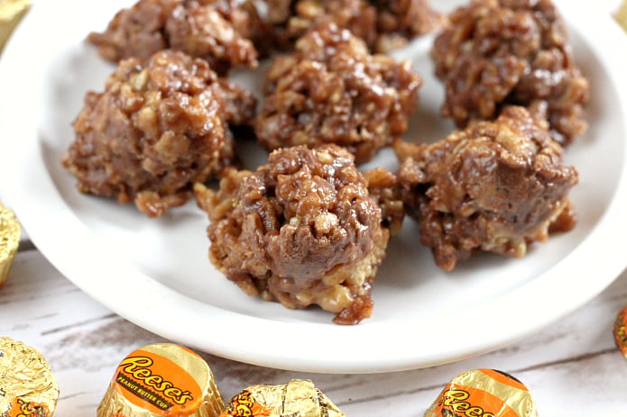 Reese's Krispie No Bake Cookies are full of chocolate, Reese's peanut butter cups, rice krispies cereal, and a few other basic ingredients. This delicious no bake cookie recipe is absolutely amazing and only takes a few minutes to make!
