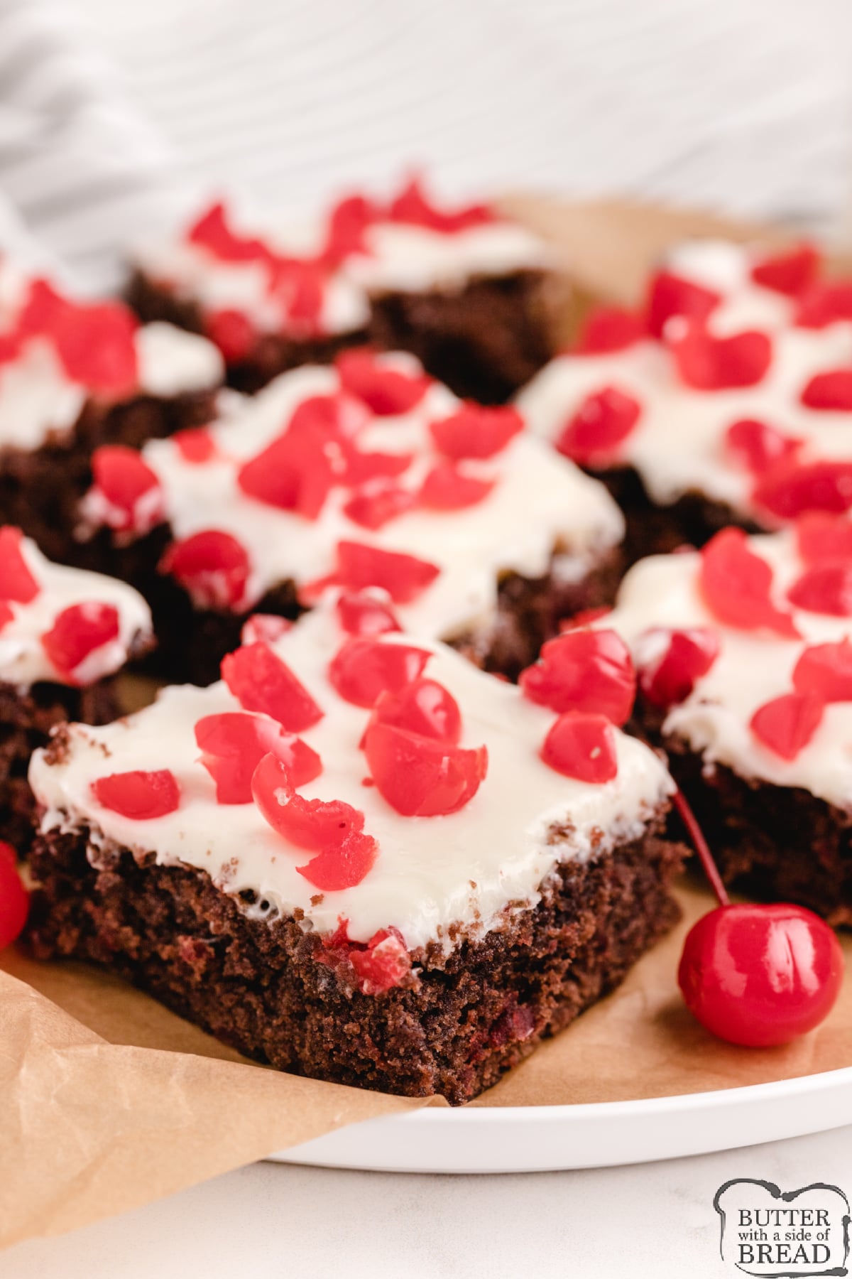 Easy Black Forest Brownies made with a brownie mix, a simple homemade frosting and chopped maraschino cherries. Simple brownie recipe that combines chocolate and cherry in a delicious way. 