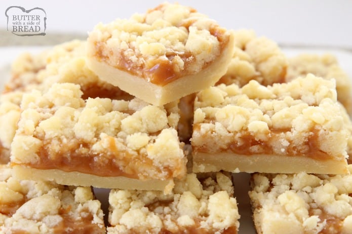 Salted Caramel Bar recipe made with a sweet shortbread crust & topped with smooth caramel and sea salt. Perfectly indulgent caramel butter bar dessert!