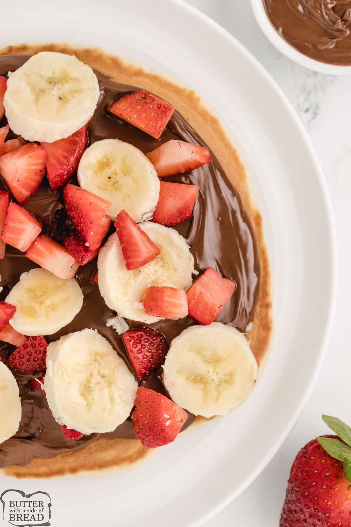 Nutella breakfast pizza recipe with strawberries and bananas