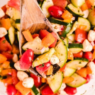 vegetable caprese salad in a clear bowl