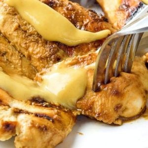 Grilled Honey Mustard Chicken recipe with a simple 4 ingredient sauce that's incredible! Yields perfectly grilled, tender, juicy chicken with amazing flavor.