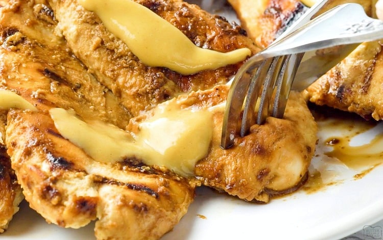 Grilled Honey Mustard Chicken recipe with a simple 4 ingredient sauce that's incredible! Yields perfectly grilled, tender, juicy chicken with amazing flavor.