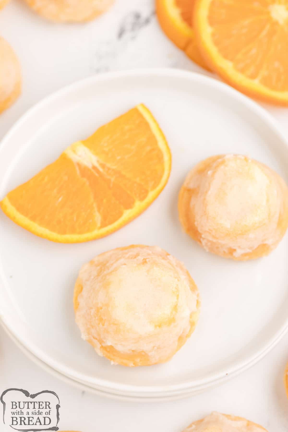 Orange Creamsicle Cake Bites are delicious bite-sized treats that start with a cake mix! The easy orange glaze soaks into the bottoms, making these little cupcakes even more incredible.