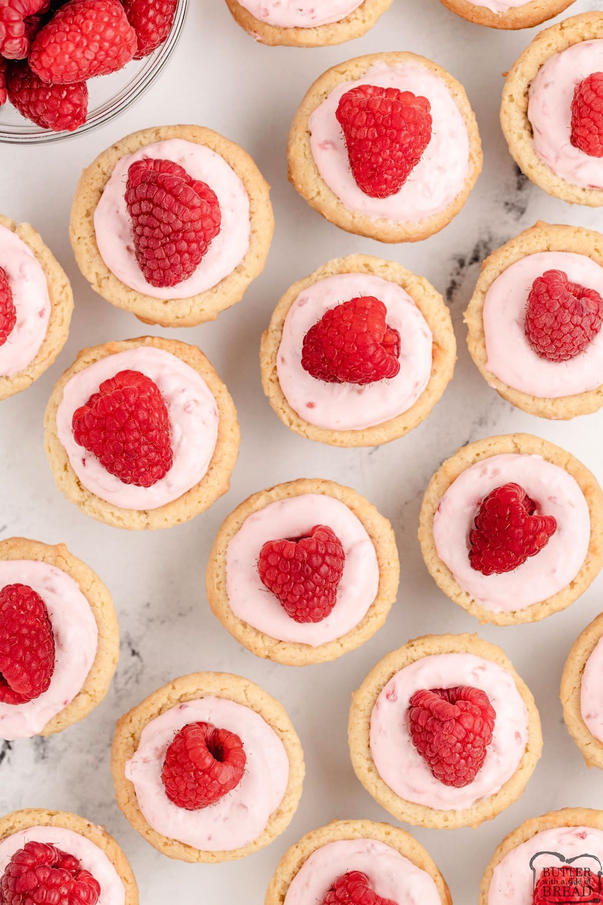 Sugar cookie cups made with a raspberry cheesecake filling