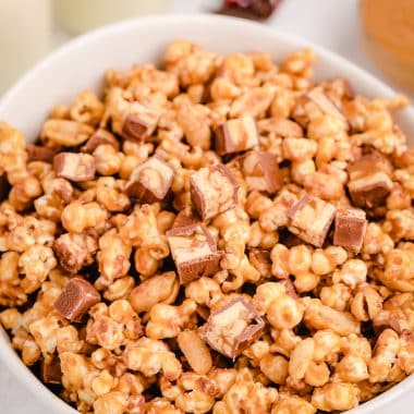 big bowl of snickers popcorn with chocolate