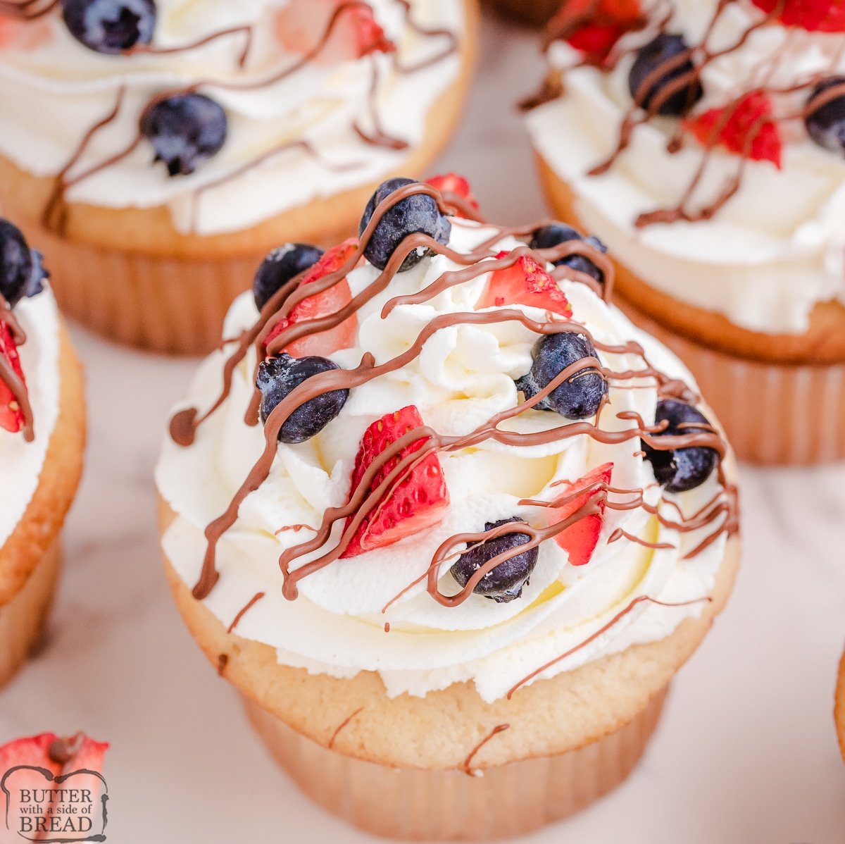 almond cream cupcakes with berries