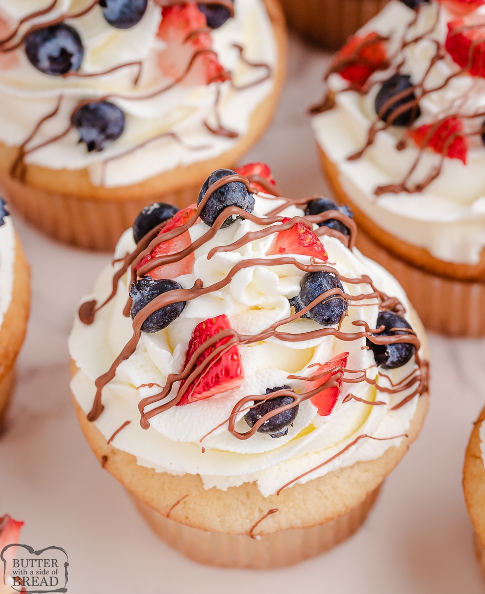 sweet almond cream on top of cupcakes with berries