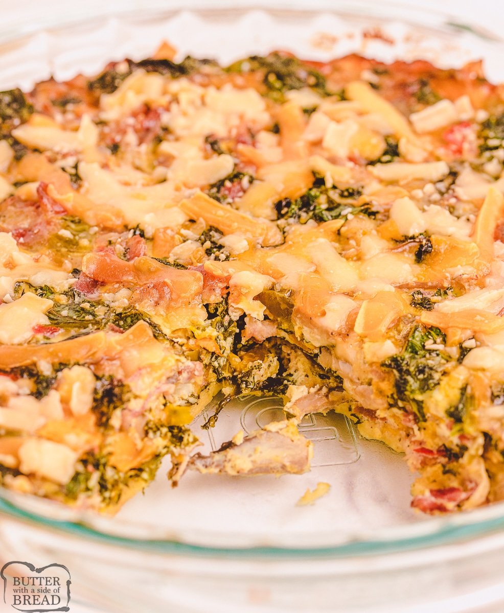 quiche recipe with bacon and kale in a pie pan with a slice taken out