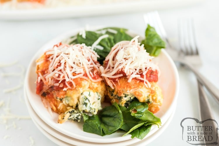 Baked Chicken Parmesan Bundles are stuffed with spinach & cheese then breaded, baked and topped with flavorful marinara sauce. Perfect baked chicken parmesan dinner recipe.
