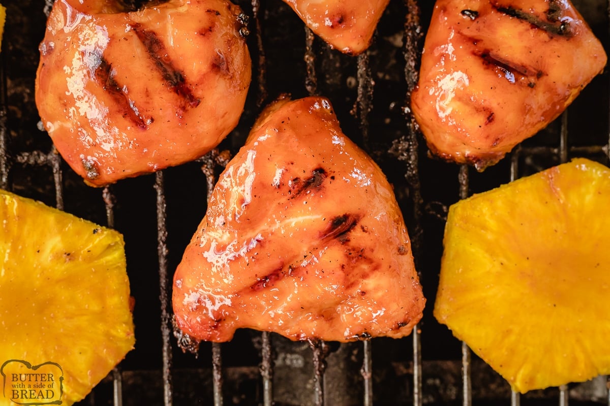 sweet spicy grilled sticky chicken on a grill