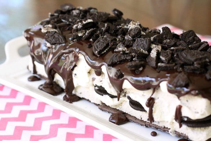 Easy Oreo Ice Cream Cake only takes minutes to assemble, yet it tastes and looks incredible with its layers of ice cream, chocolate graham crackers, whipped cream, Oreos, and chocolate ganache.