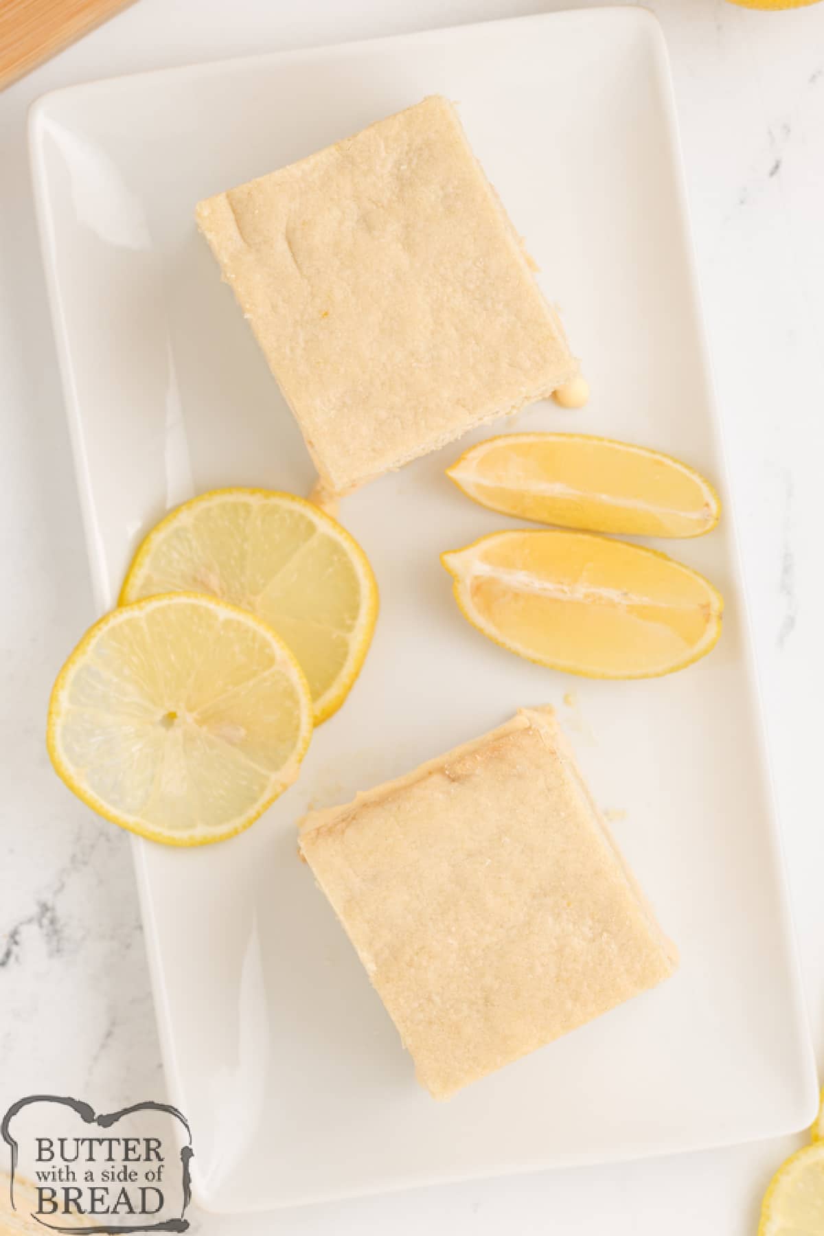Lemon Ice Cream Bars are made with a delicious lemon ice cream filling sandwiched between two layers of homemade lemon cookie crust. This ice cream sandwich recipe is so simple to make, it makes a perfect summer treat!