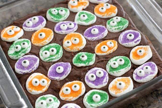 Marshmallow Monster Fudge takes a simple and delicious fudge recipe, and adds these adorable monster faces to the top to make an easy and cute Halloween treat!
