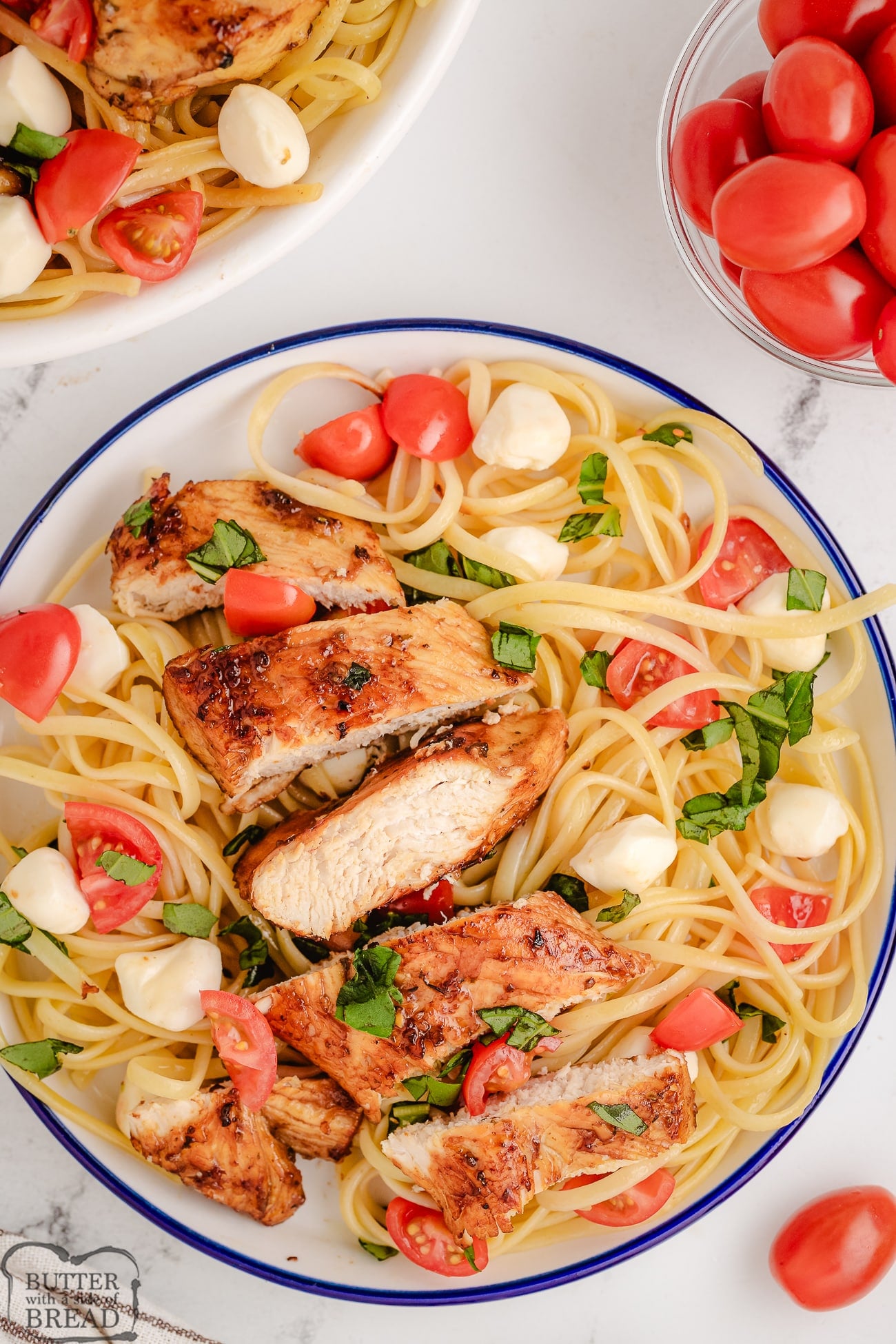 chicken caprese pasta for dinner with sliced chicken