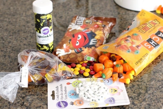Halloween Popcorn is the perfect snack for the fall - you can't go wrong combining buttery popcorn and Halloween candy!