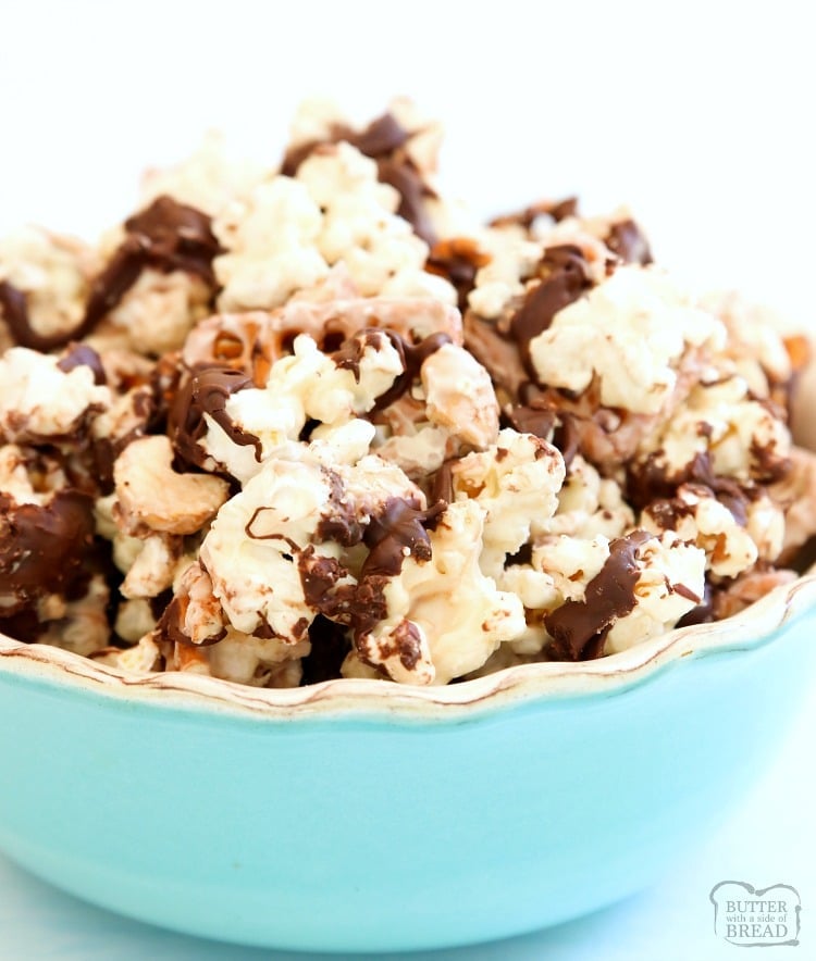 Chocolate Popcorn made with white and semi sweet chocolate, pretzels and cashews! Our easy-to-make white chocolate popcorn recipe is the perfect blend of salty & sweet.