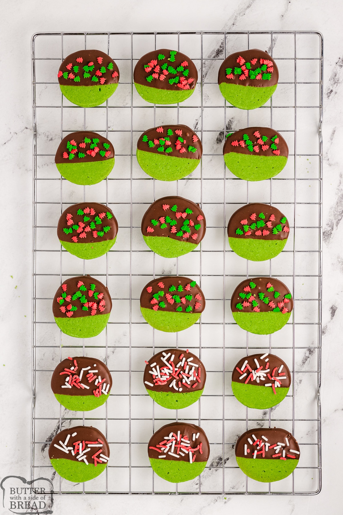 chocolate dipped green cookies with sprinkles