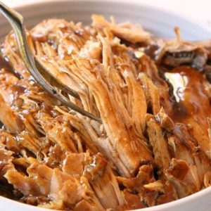 Slow Cooker Pork Roast made with simple ingredients you have in your pantry! Fall-apart tender pork with a flavorful gravy on top make this recipe amazing.
