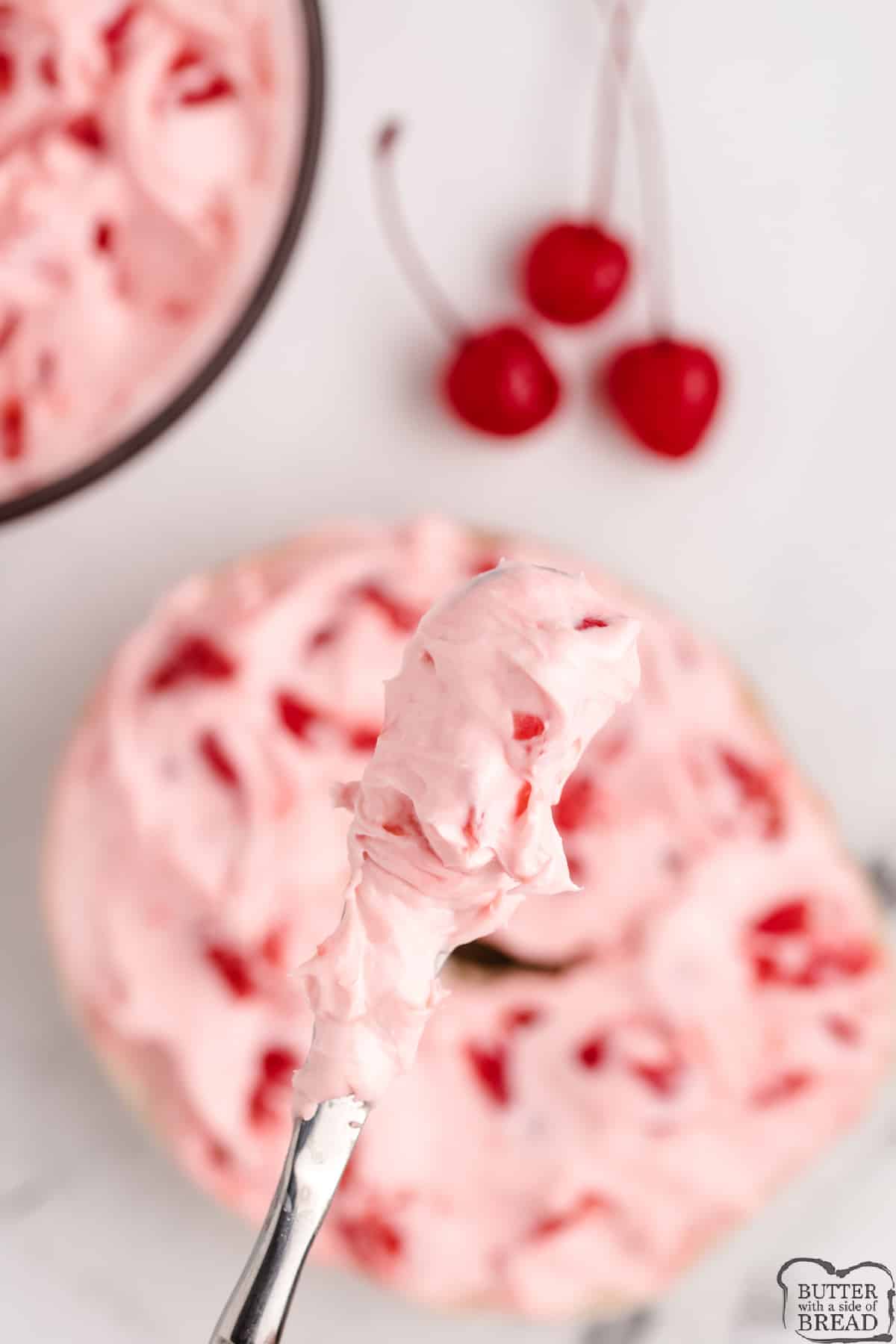 Knife with cherry spread made with cream cheese
