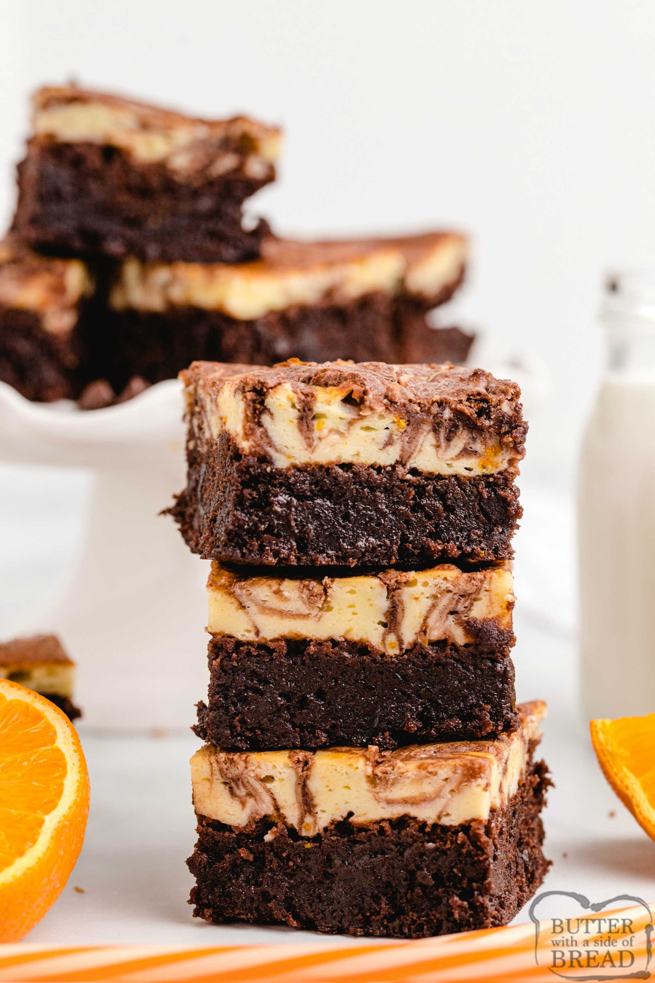 Orange Cheesecake Brownies made with a delicious orange cheesecake layer that is swirled with a simple brownie mix. The orange and chocolate combination is absolutely incredible! 