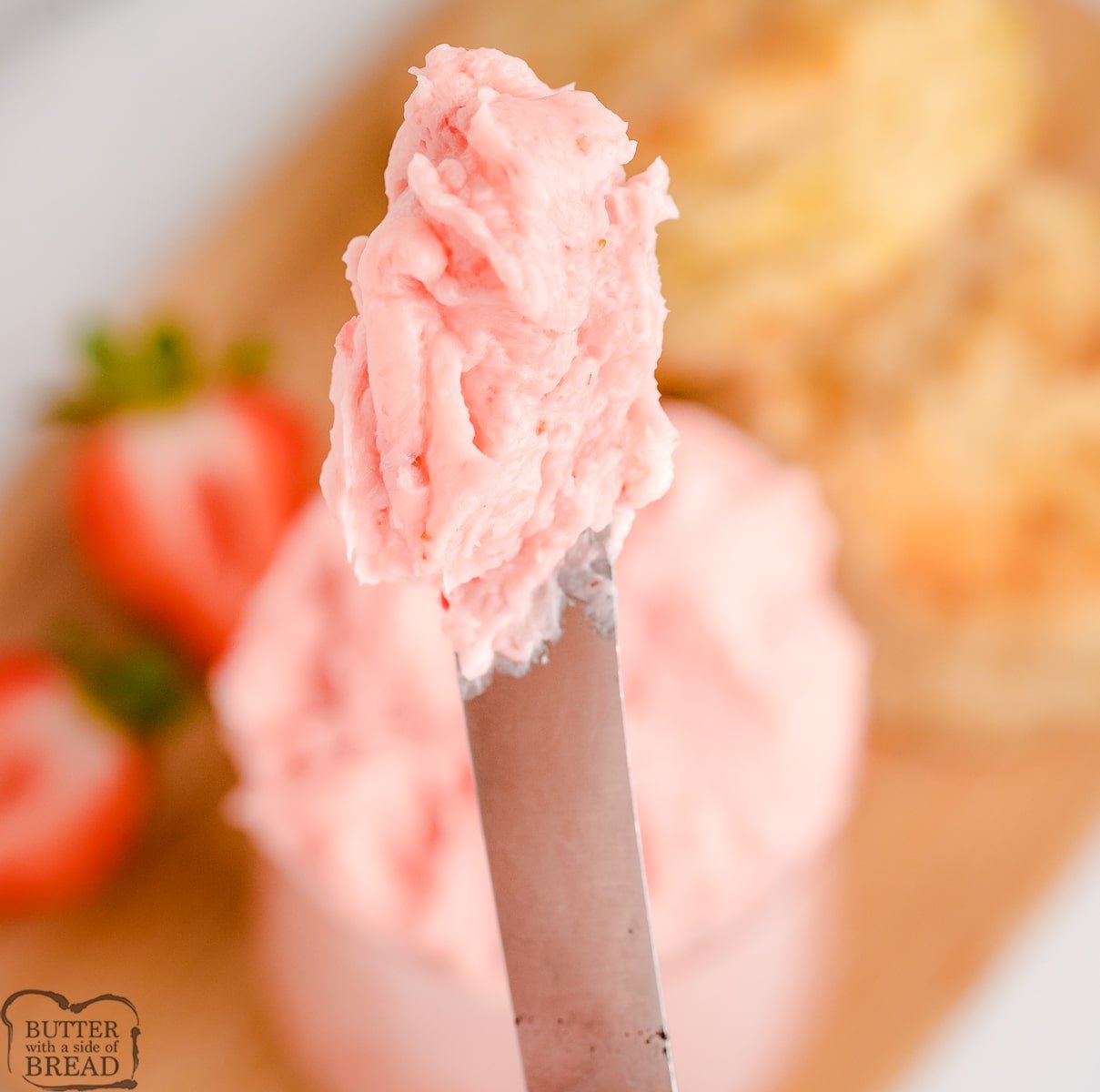 knifeful of strawberry butter