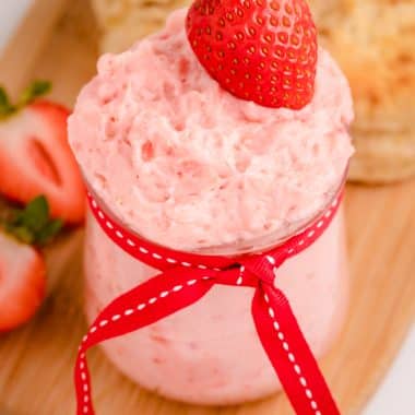 jar of strawberry butter with fresh strawberries